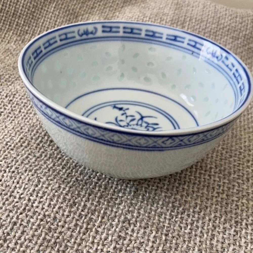 Small Chinese blue white porcelain bowl with brown glaze specks.